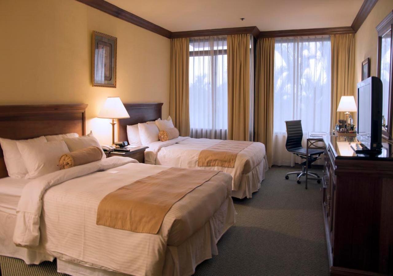 Queen Room with Two Queen Beds and Pool View - Non-Smoking